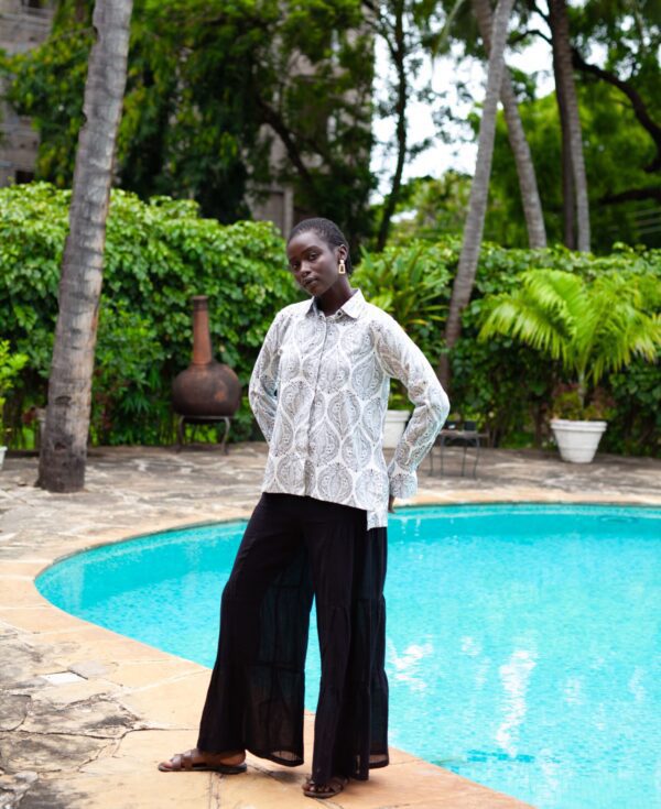 RIYA pallazo pants by Mariam Couture are the ultimate summer pants, featuring an elastic waistband, side tiers and a roomy fit. Crafted in sheer cotton gauze.