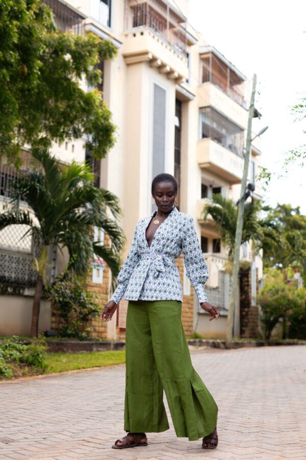 Charly wrap top with long cuffed bishop sleeves, made from hand block printed cotton. Versatile design with a detachable belt, tied around the front. 100% cotton, handmade in Kenya.