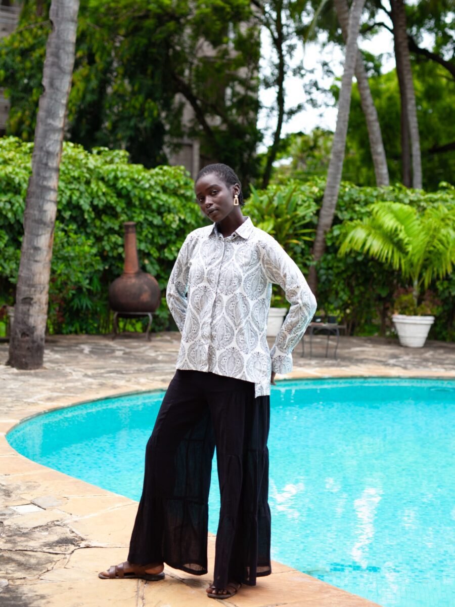 RIYA pallazo pants by Mariam Couture are the ultimate summer pants, featuring an elastic waistband, side tiers and a roomy fit. Crafted in sheer cotton gauze.