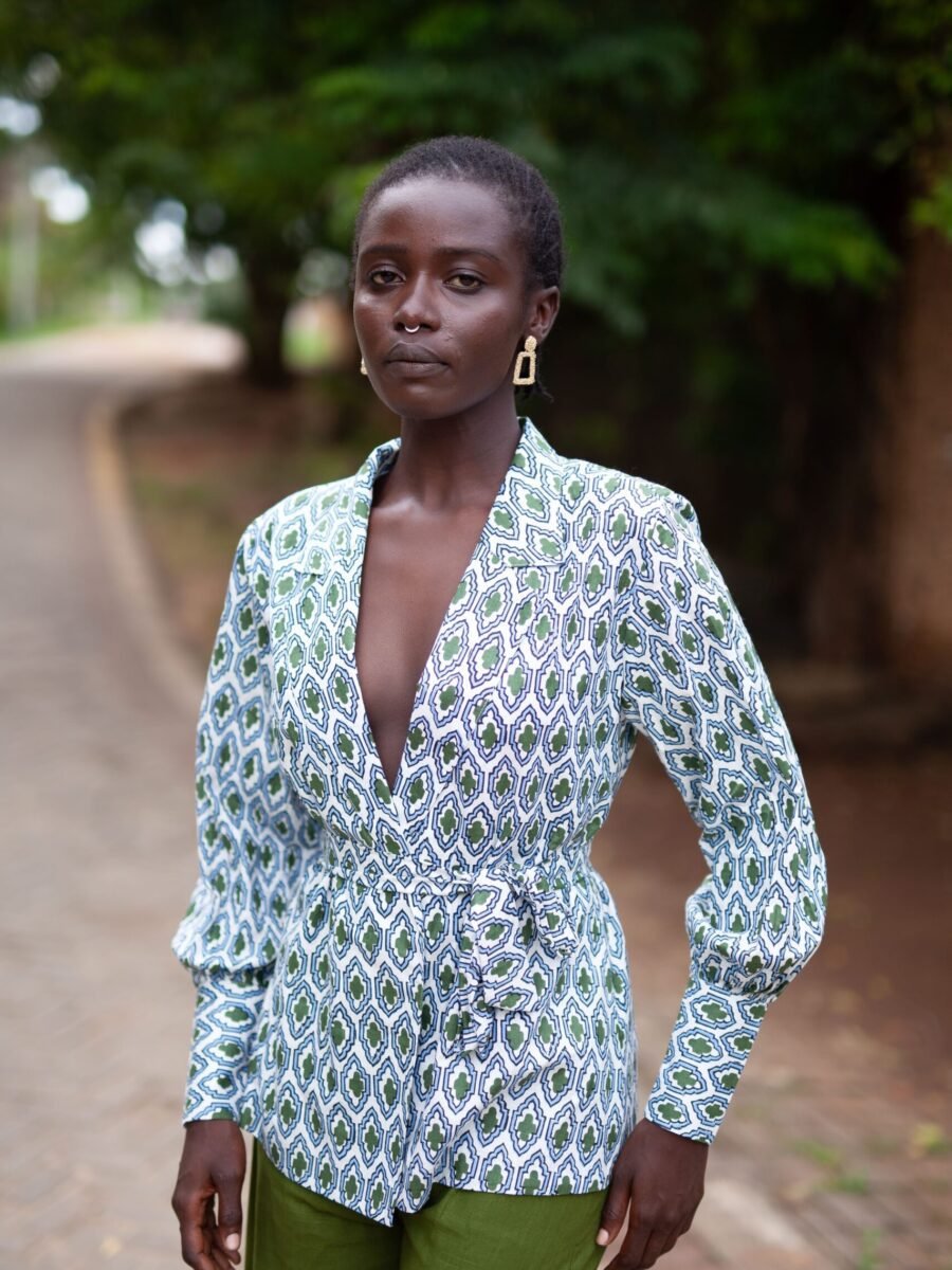 Charly wrap top with long cuffed bishop sleeves, made from hand block printed cotton. Versatile design with a detachable belt, tied around the front. 100% cotton, handmade in Kenya.