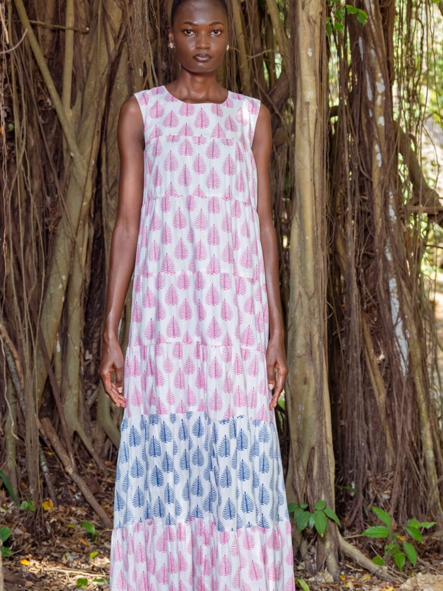 A model wearing the Jimbi dress by Mariam Couture. This African fashion dress comes in two prints where either is the perfect choice for those who appreciate the beauty of simplicity and the confidence that comes while wearing a well-designed piece. This piece infuses a sensual design with casual elegance assisted by its body-hugging, fit-and-flair silhouette. It can be worn belted or with a classic t-shirt underneath.